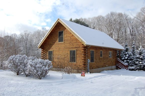 Log House in Snow